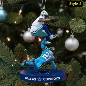 Yes Im Old but I saw Cowboys America's Team Ornament 8 A detailed view of a Cowboys themed ornament capturing an athletic leap above a defender displayed among festive tree ornaments!