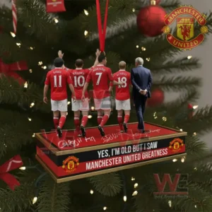Ornament of football players in red kits on a platform with a Manchester United greatness message hanging on a Christmas tree!