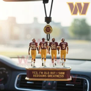 Four small football figurines hang from a car mirror on a base with a nostalgic message.