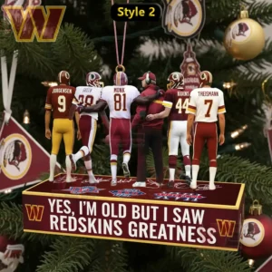 Miniature football player ornaments hang on a platform in a decorated Christmas tree.