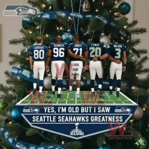 Yes Im Old but I saw Seattle Seahawks Greatness Ornament 5 Alt text: A close-up view of a Seattle Seahawks ornament with figurines of famous players displayed on a Christmas tree.