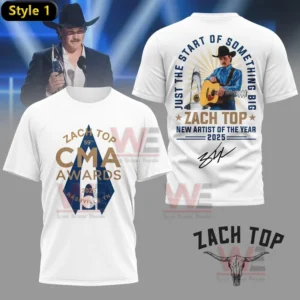 Alt text: White t-shirt with the front displaying "Zach Top 59th CMA Awards 2025 Nashville, TN" and the back showing Zach Top playing a guitar with "Just the Start of Something Big" and "Zach Top New Artist of the Year 2025."