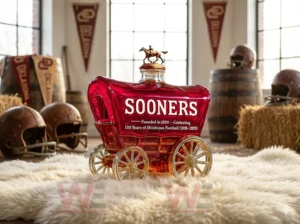 Red wagon shaped commemorative bottle with gold wheels and horse topper displayed in a rustic football themed room!