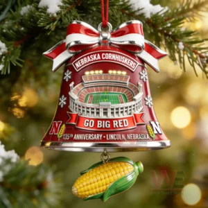 Red bell Christmas ornament with a football stadium design and corn charm hanging on a decorated tree!