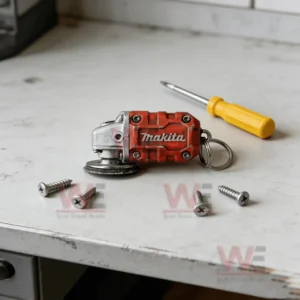 Mini red grinder keychain on a white workbench with metal screws!