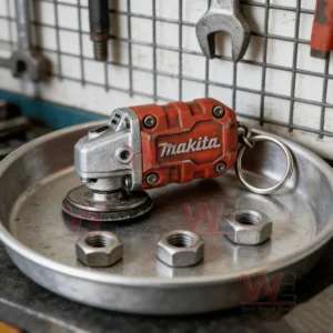 Mini red grinder keychain resting on a metal tray with bolts!
