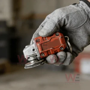Mini grinder keychain tool held in a gloved hand with focus on metal texture and compact design!