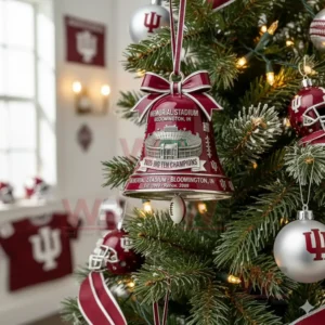 A red championship bell ornament displayed on a Christmas tree with sports themed decor in the background!