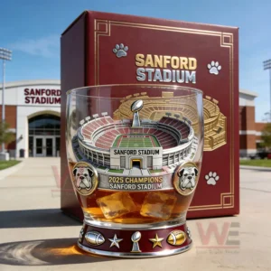 Sanford Stadium championship themed whiskey glass filled with amber drink displayed outside the stadium with a decorative box in the background!
