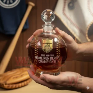 Hands holding a round crystal whiskey decanter filled with amber liquid and engraved with a championship theme!