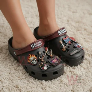 5 Seconds of Summer Crocs Crocband Clogs with Charms 4 Feet wearing black clogs with music band charms standing on a light colored carpet in an indoor environment!