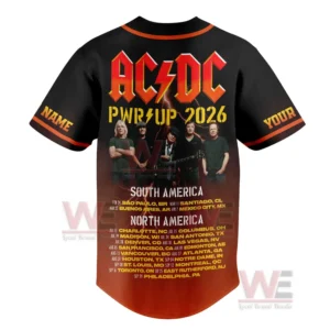 Image displaying the back of an AC DC tour jersey with band lineup photo vivid text and multiple city dates listed for the 2026 tour!