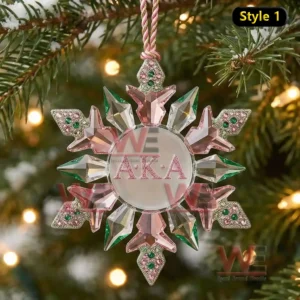 Star shaped ornament with pink and green crystal like pieces on a Christmas tree!