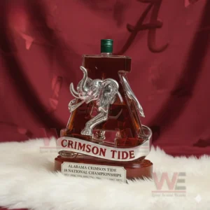 Letter A shaped whiskey bottle with clear elephant sculpture and Crimson Tide branding!