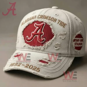 Close up of a light gray distressed Alabama Crimson Tide cap with a red A logo gold embroidered text a Bryant Denny Stadium patch and 1892 to 2025 stitched on the brim.