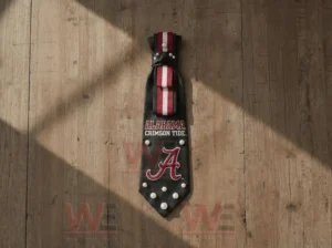 Alabama Crimson Tide premium necktie with red white stripe and team logo on wood background!
