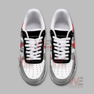Top view image showing the sneakers with white laces black tongue panels and detailed artwork on the outer sections!