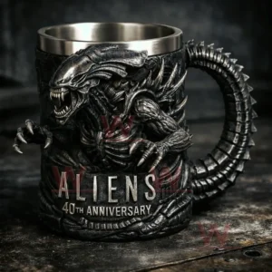 Black alien creature mug with a monster shaped handle and metallic inner cup on a dark surface!