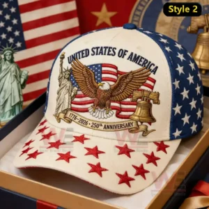 White and navy baseball cap with United States Of America text eagle wings American flag Statue of Liberty liberty bell and red stars on the brim.