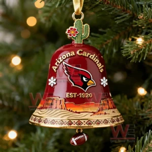 A close up of a red Arizona Cardinals bell ornament with desert themed artwork hanging on a lit Christmas tree!