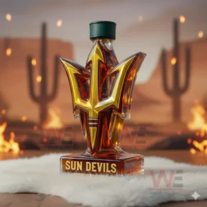 A trident themed bottle filled with amber liquid positioned before a scenic desert backdrop featuring cacti!