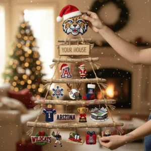 A handcrafted wooden branch Christmas wall tree decorated with Arizona Wildcats ornaments held by a person in a warm festive living room!