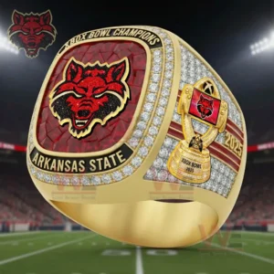 Gold and diamond Arkansas State Red Wolves Xbox Bowl Champions 2025 ring shown against a football stadium backdrop!
