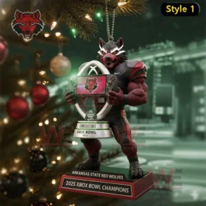 Red wolf mascot football ornament holding a trophy with Arkansas State Red Wolves 2025 Xbox Bowl Champions text displayed near a decorated Christmas tree!