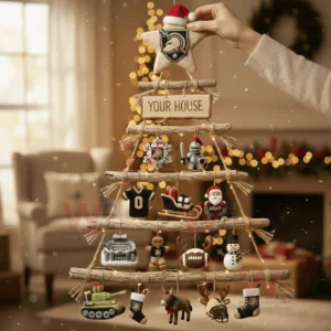A wooden branch Christmas wall tree decorated with Army Black Knights themed ornaments held by a person in a warm holiday living room!