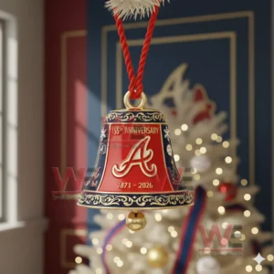 A detailed Atlanta Braves anniversary bell ornament with gold trim displayed in front of a decorated Christmas tree!