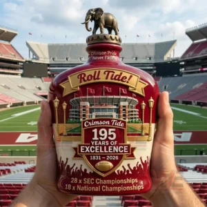 A held bottle with Alabama anniversary designs shown inside a stadium!