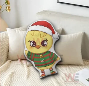 Holiday themed chicken shaped decorative pillow on a sofa in a warm home setting!