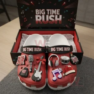 Red music themed clogs in a box decorated with multiple band related charms including instruments and music symbols!