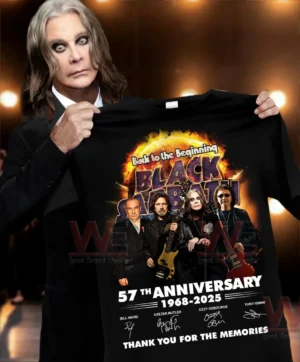 Image showing a person holding a commemorative band shirt with vibrant artwork portraits anniversary dates and signatures!