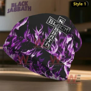 A black beanie with purple flames and a cross logo placed on a wooden surface!