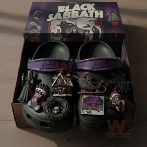 Black clogs with dark themed charms displayed inside a decorated box featuring artwork inspired by a rock band!