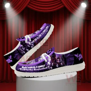Side view of purple slip on shoes with rock band artwork against a theatrical background!