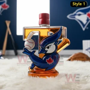 A glass bottle shaped with a large letter form and a blue jay mascot holding a baseball against a soft indoor background!