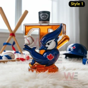 A glass bottle with a blue jay design and a dark top placed among bats balls and team items in a sunlit room!