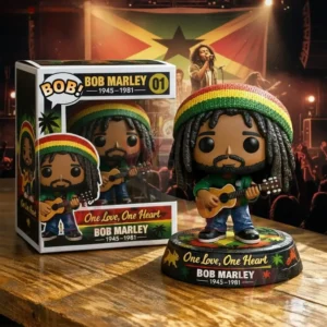 A vinyl style musician figure with dreadlocks and a guitar standing on a themed base next to a display box with a concert backdrop!