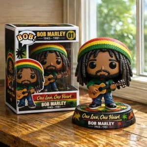 Bob Marley One Love One Heart Reggae Legend Pop Vinyl Figure 3 A vinyl style musician figure with dreadlocks and a guitar standing on a base beside its display box on a wooden table by a window!