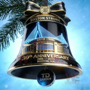 A decorative bell ornament with a glowing architectural outline and celebratory details hanging from a tree branch!