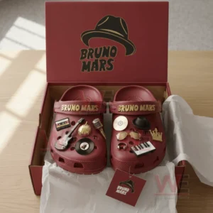 Red crocs in a gift box decorated with numerous Bruno Mars themed charms including music and fashion elements!