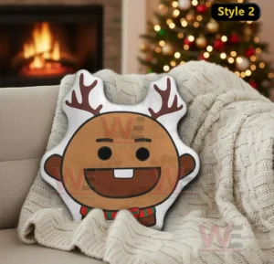 Reindeer cartoon pillow with antlers displayed on a cozy sofa in a christmas living room setting!