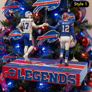 Holiday ornament with two football quarterback figures posed together on a base hanging on a decorated Christmas tree!