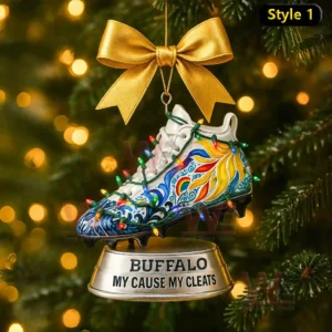 A detailed Christmas ornament shaped like a decorated cleat with vivid patterns and lights attached to a Buffalo marked base hanging on a holiday tree!