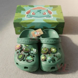 Bulbasaur Pokemon Crocs Clogs with Charms 5 Green clogs with Bulbasaur themed charms arranged neatly in front of a matching decorated box!