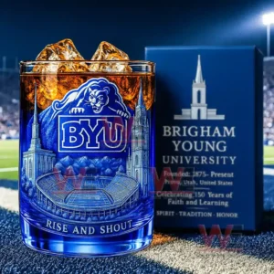 Blue BYU whiskey glass with cougar logo stadium illustration and school pride text displayed on a football field!