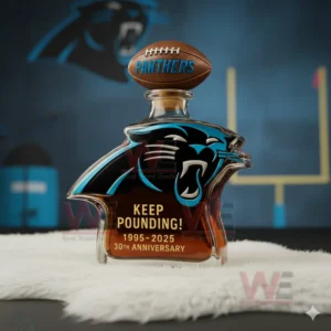 Carolina Panthers Keep Pounding 30th Anniversary 1995-2025 Whiskey Bottle 4 A bottle formed as the Panthers emblem shown in a brightly lit sports environment with bold team colors!