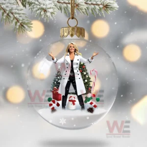 A transparent ornament showing a woman in a white coat standing before a decorated Christmas tree with holiday decorations!